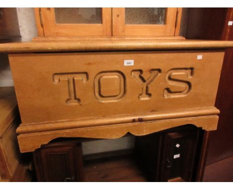 Polished pine toy trunk together with a small pine hanging cabinet 