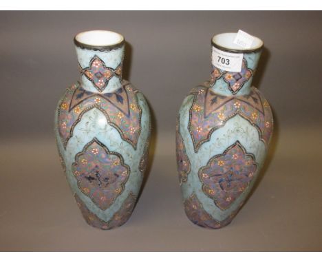 Pair of Victorian blue opaque glass vases, enamel decorated in Persian pattern27cms highSome loss of paint and gilt 