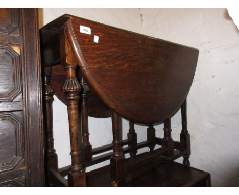 Early 20th Century oak gate leg table, a 19th Century bamboo occasional table, an Edwardian shaped top occasional table and a