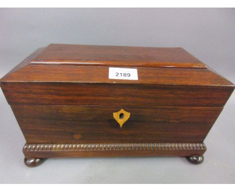 19th Century rosewood three division sarcophagus shaped tea caddy with original mixing bowl and plated spoon, 12ins wide 
