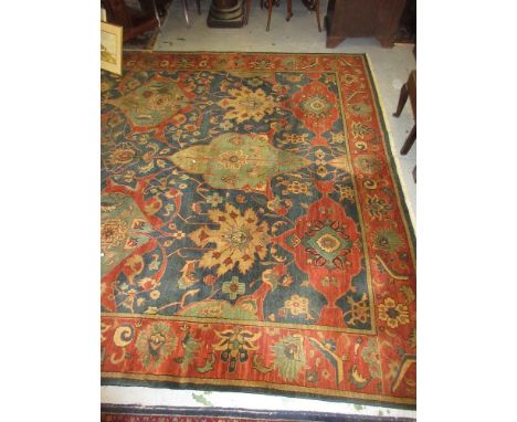 Agra carpet of all-over floral design on burgundy ground with multiple borders, 119ins x 167insSome losses to fringe and fade