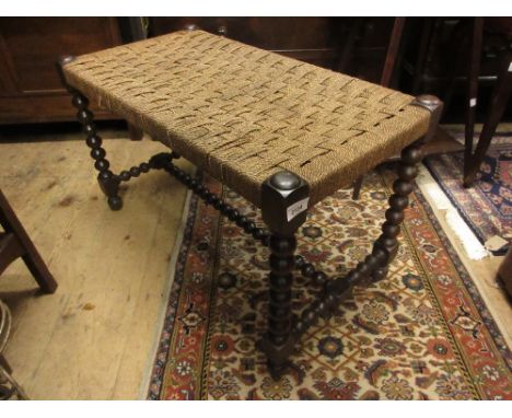 Large early 20th Century rectangular stool with a woven string seat on bobbin turned support 