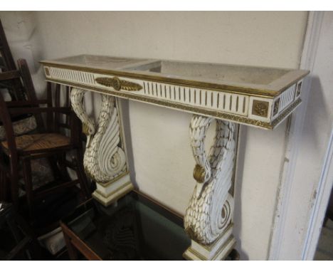 20th Century white painted and gilt console table, the supports in the form of swans (lacking top), 32ins high x 46ins wide x