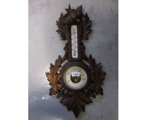 Late 19th or early 20th Century Black Forest type carved walnut aneroid barometer thermometer 
