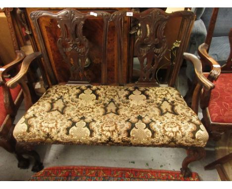 Early 20th Century mahogany two seat sofa in Chippendale style with a pierced splat back, upholstered seat and carved cabriol