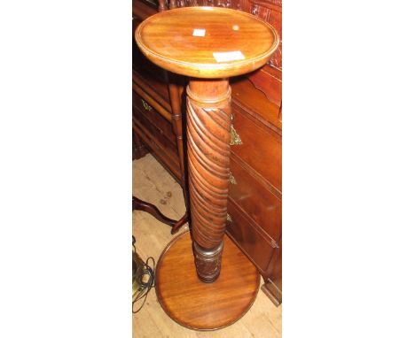 Circular mahogany torchere with spiral twist column and tripod support 