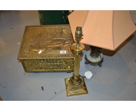 Embossed brass slipper box together with a brass Corinthian column table lamp and a gilded spelter figural table lamp 