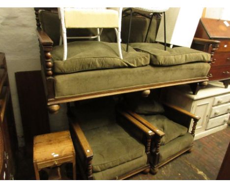 Early 20th Century oak three piece bergere suite having floral carved and bobbin turned decoration with loose cushions, compr