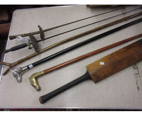 Three walking sticks, two fencing foils and a vintage cricket bat 