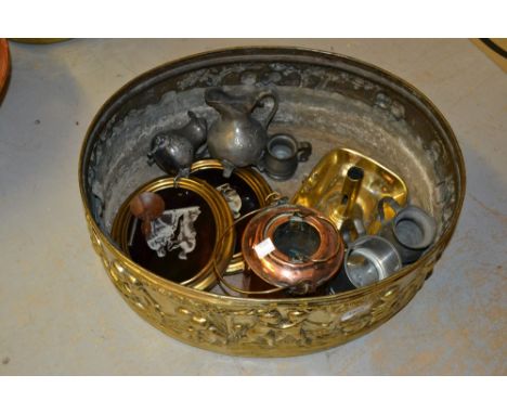 Large antique oval copper planter with embossed decoration of figures in a landscape together with a brass chamber candlestic