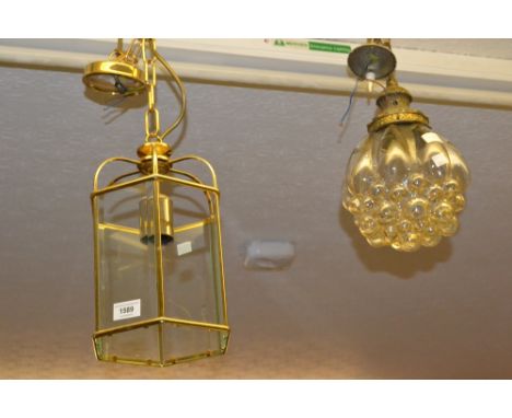 Four various hanging lights, together with a Chinese style pottery table lamp 