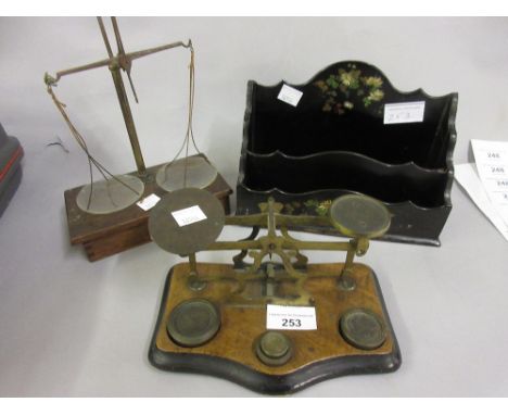 Pair of 19th Century walnut and brass postal scales, pair of antique brass balance scales, papier mache letter rack 