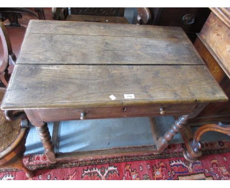 18th Century oak side table with a plank top above a single frieze drawer raised on bobbin supports with stretchers 