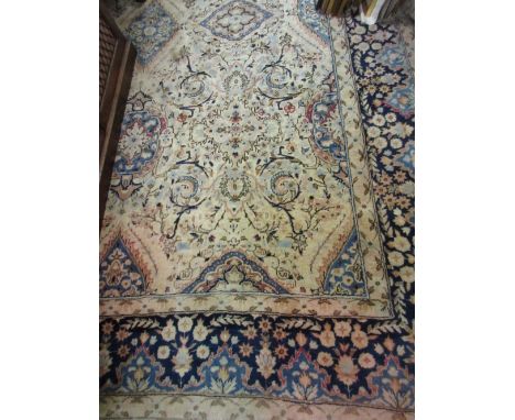 Sparta carpet with an all-over medallion and floral design with borders on an ivory ground, 138ins x 98insSome loss of fringe