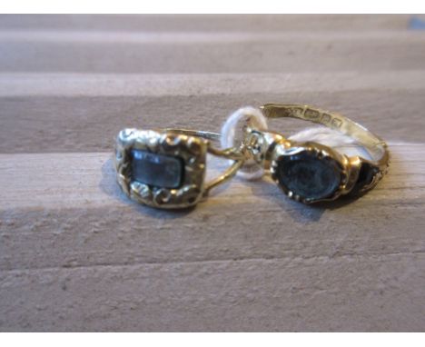 Two 19th Century yellow gold memorial ringsBoth rings have plaited hair beneath the glass.The fragments of black enamel ring 