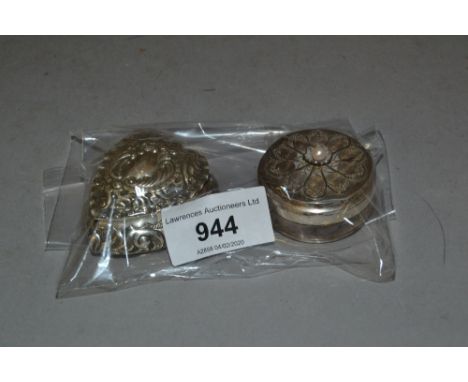 Small silver heart shaped trinket box with embossed decoration, together with a similar circular box 
