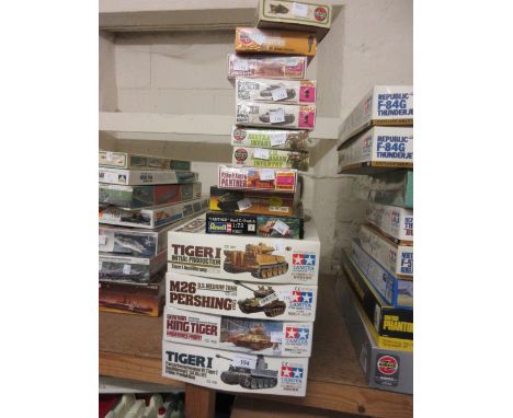 Four boxed Tamiya scale model tank construction kits, together with other small boxed tanks etc. 