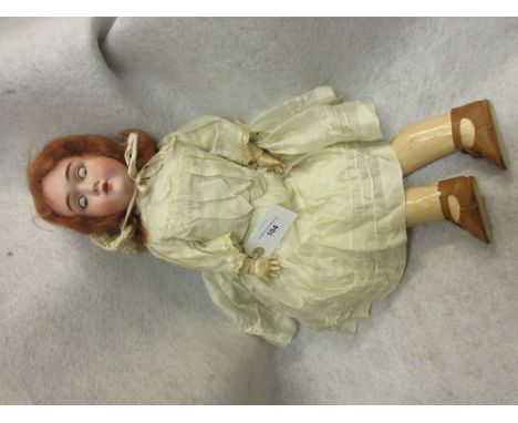 Handwerck German bisque headed doll with sleeping eyes, open mouth and four teeth, the head inscribed 0 1/4 with jointed comp