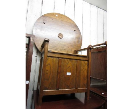 Reproduction oak monks bench with a circular folding top together with a reproduction oak coffer with Gothic carved panel fro