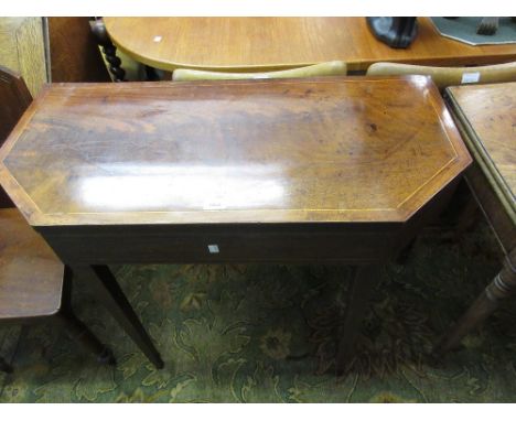 George III mahogany and line inlaid fold-over card table with canted corners, raised on square tapering supports 