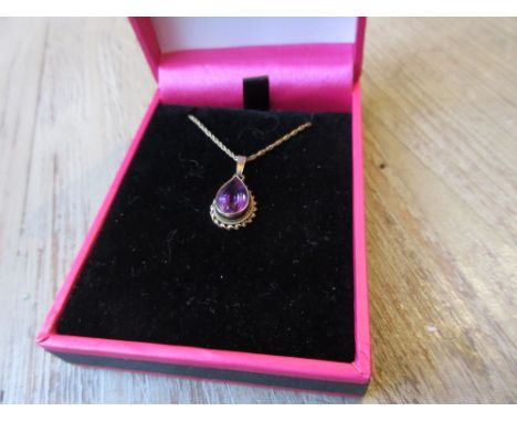 9ct Gold and amethyst pendant on a 9ct gold chain 