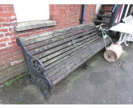 Large black painted cast iron and wooden slatted garden bench 