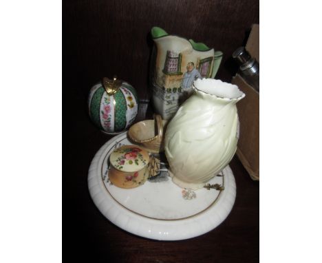 Miniature Royal Worcester blush ivory rouge pot and cover, two similar items (at fault), a Goss teapot stand, porcelain apple