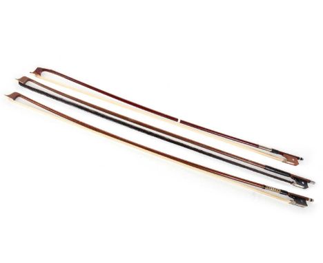 THREE VIOLIN BOWS, 20TH CENTURY each unmarked, with cylindrical stick and white metal mountsthe longest 75cm