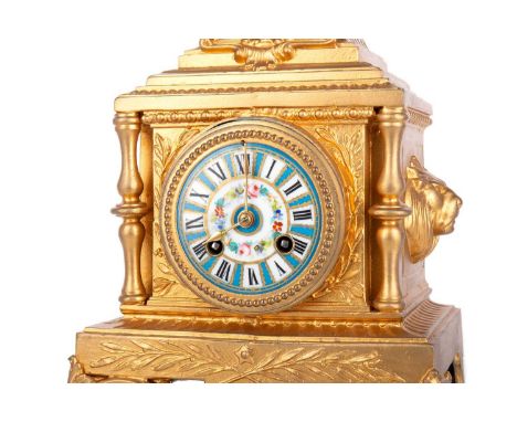 FRENCH GILT METAL MANTEL CLOCK, LATE 19TH CENTURY with cherub surmount, twin lion masks, the floral decorated porcelain dial 