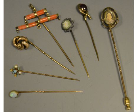 Stick Pins - A 15ct gold stick pin, turquoise peridot and seed pearl inclusions; various gold coloured metal pins; a Victoria