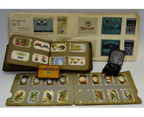 An unusual album containing cigarette packets including The Three Castles Cigarettes, Scotties, Army Club Sandhurst Size; Pre