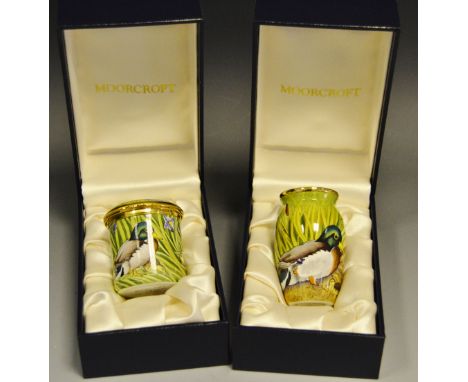 Moorcroft Enamels - a miniature vase decorated with a Mallard, Drake and duckling, boxed; a cylindrical trinket pot decorated