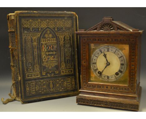 A 19th century German mantel clock; a 19th century family bible (2)
