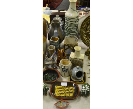 Studio Pottery - a Troika type vase, initialled to base 'T'; an Ashwell pottery figure of a man playing the hurdy gurdy; slip