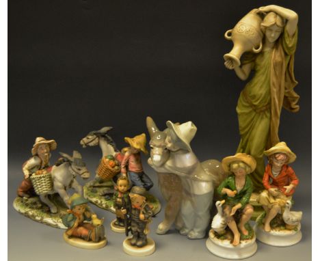 Decorative ceramics - a Lladro figure of a donkey & young boy; a Hummel figure of a Chimney Sweep, others boy seated with bir