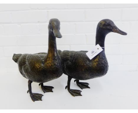 A pair of bronze patinated metal ducks, 40cm high, (2) 
