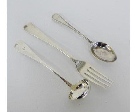 Victorian silver sauce ladle, Glasgow 1851, Irish silver table fork, Dublin 1842 & a foliate engraved silver spoon, London 18