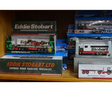 A shelf of Eddie Stobart vehicles, and various motoring books 