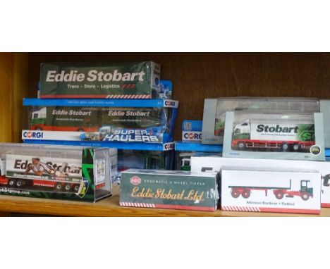 A shelf of Eddie Stobart souvenir vehicles 