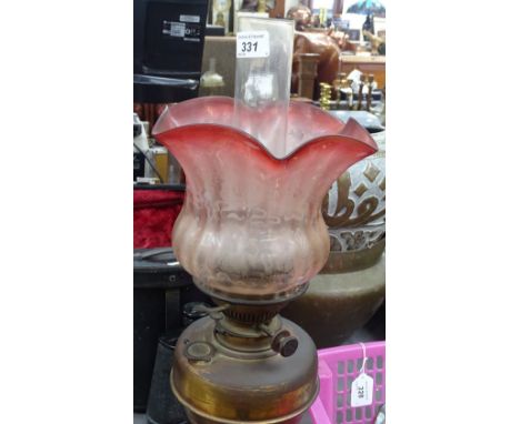 An oil lamp with etched cranberry glass shade, 22.5" 