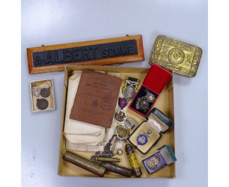 A First World War Queen Mary tin, and commemorative items, Regimental badges, a Territorial Army medal, and ephemera 