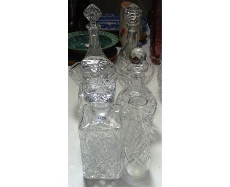 A ship's decanter, and 4 others with stoppers, a scent flask etc 
