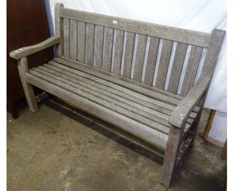 A weathered teak slatted garden bench, L151cm 