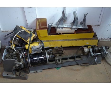 A bench-mounted metal turning lathe and accessories (for assembly) 