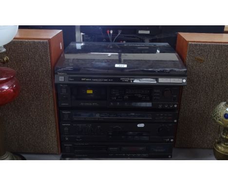 A Technics music centre, comprising turntable, cassette deck, tuner, amplifier, CD player, and speakers 