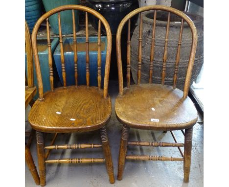 A pair of 19th century elm-seated stick-back kitchen chairs, on turned legs 