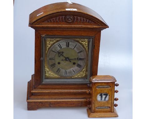 An oak perpetual calendar, and an oak-cased mantel clock with 2-train movement, height 15" 