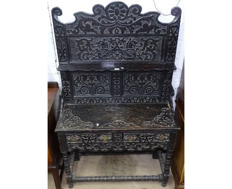 An Antique oak dresser, with a carved panelled raised back, 2 frieze drawers, raised on bobbin turned legs, W98cm, H165cm 