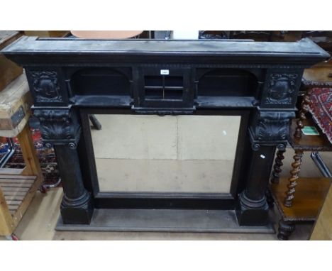 A Victorian ebonised architectural design over mantel mirror, with acanthus leaf carved decoration, and turned columns, W149c