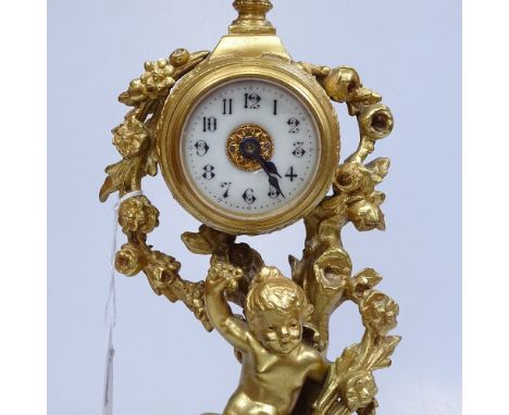 A Continental gilded spelter clock on onyx plinth, height 11.75" 